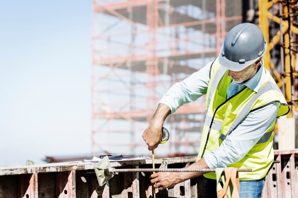 Architect Measuring Metal at Site