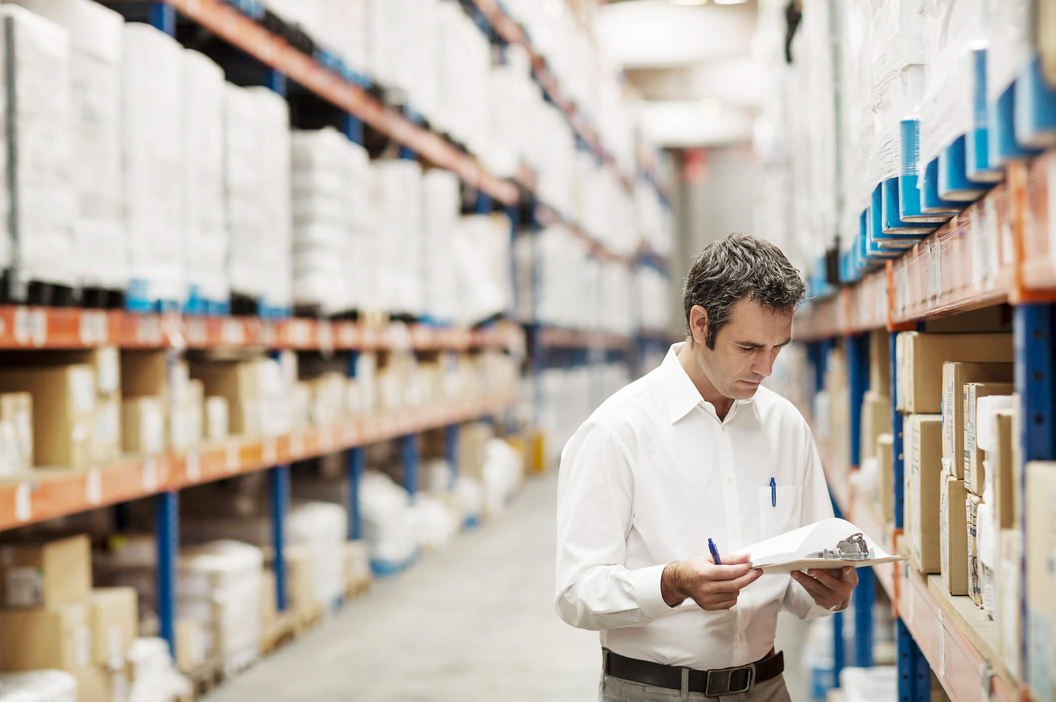 Supervisor analyzing documents in warehouse (1)