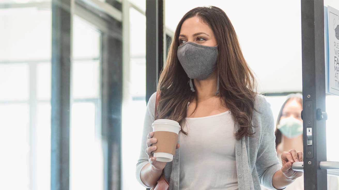 person-with-mask-entering-store