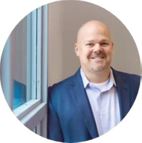 Professional headshot of Dennis Hartin