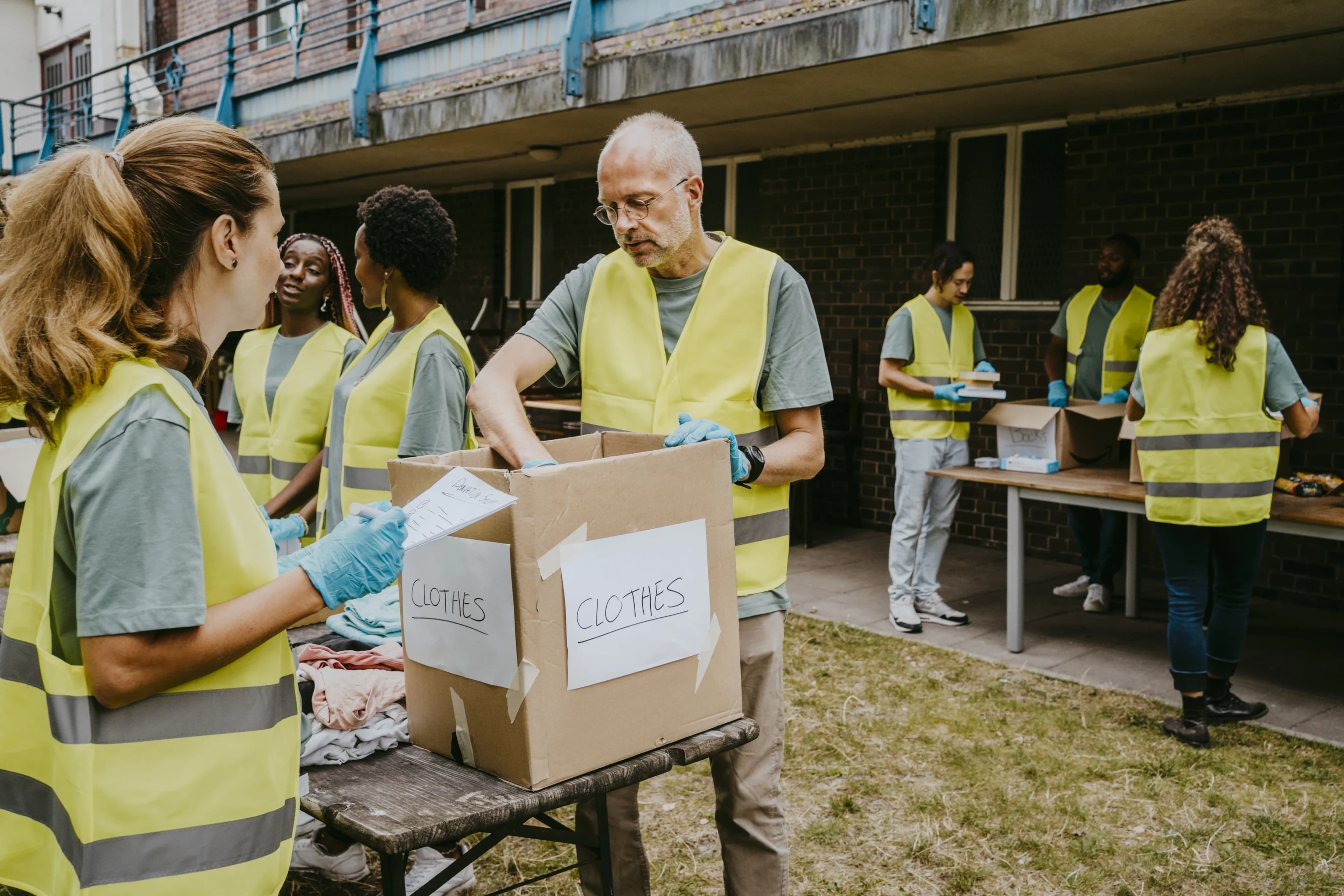 volunteers-labelling-clothing-boxes