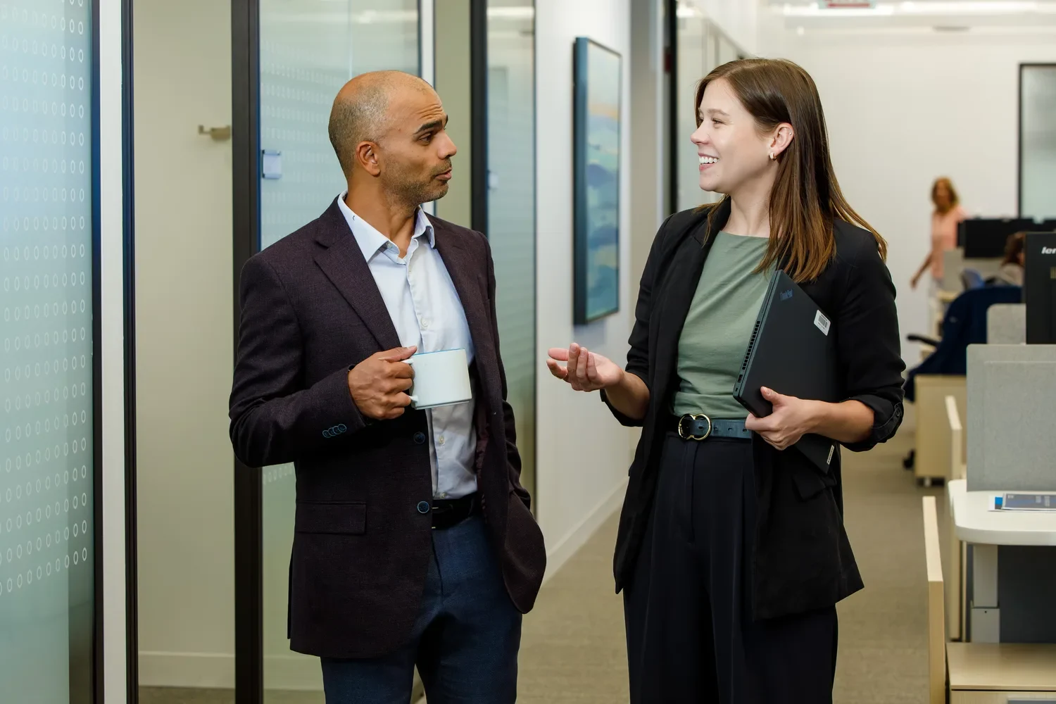 colleagues-talking-in-hallway