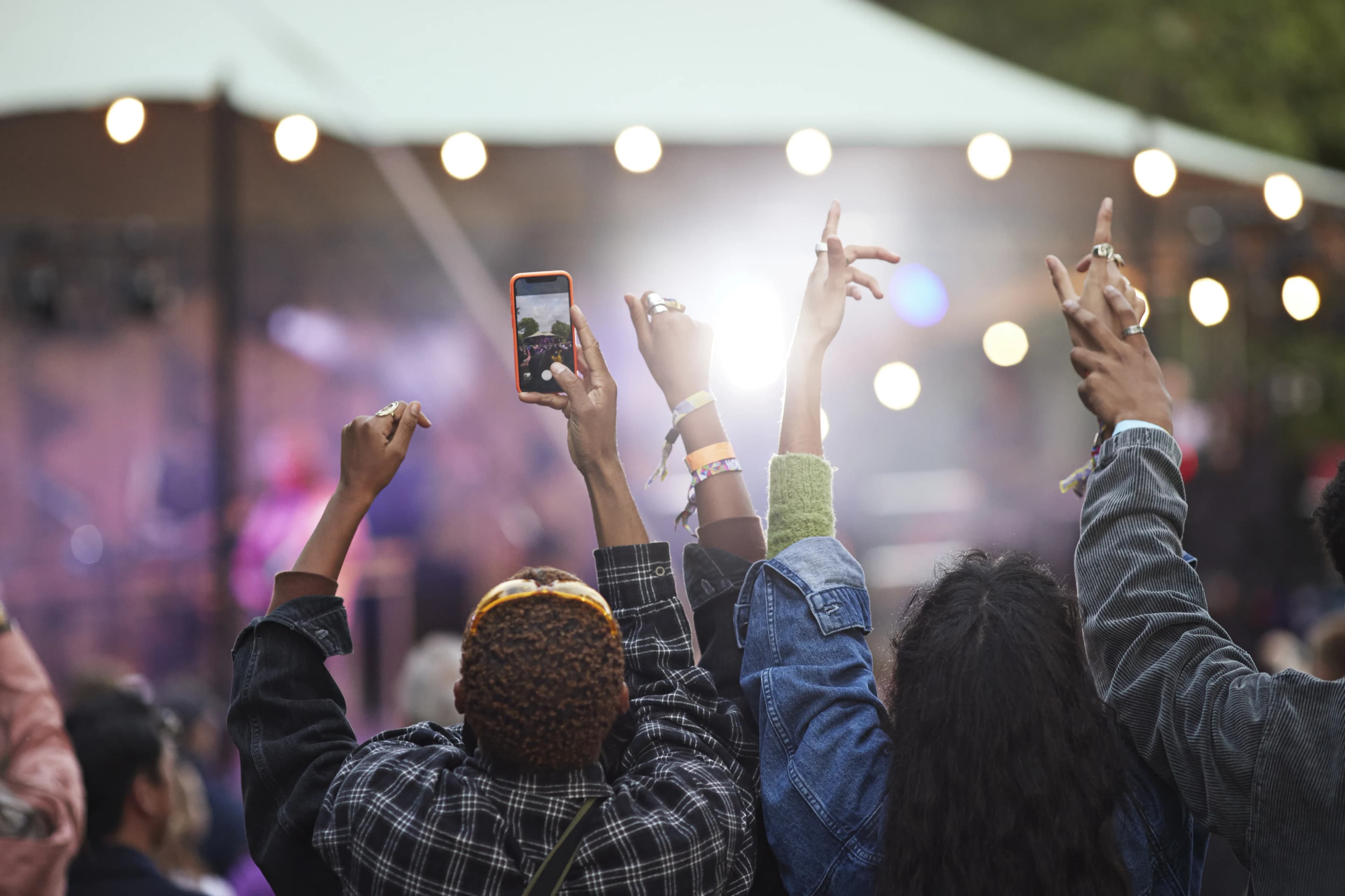 concert-crowd-hands-raised