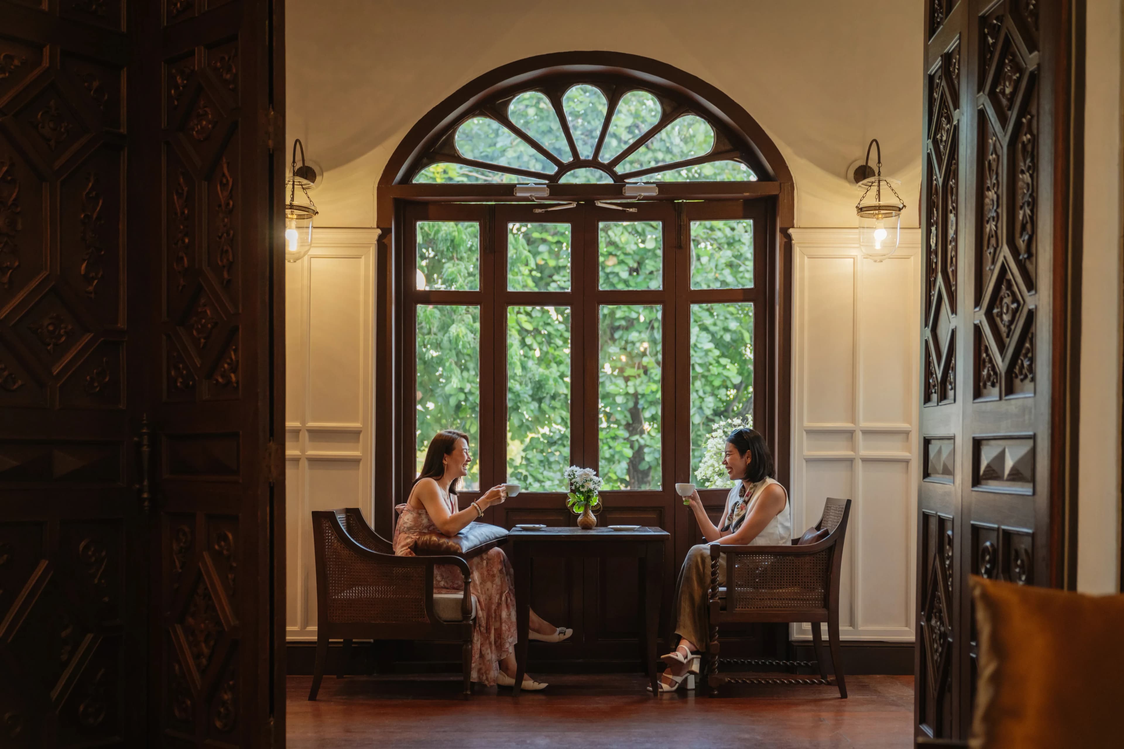 women-having-tea-by-window