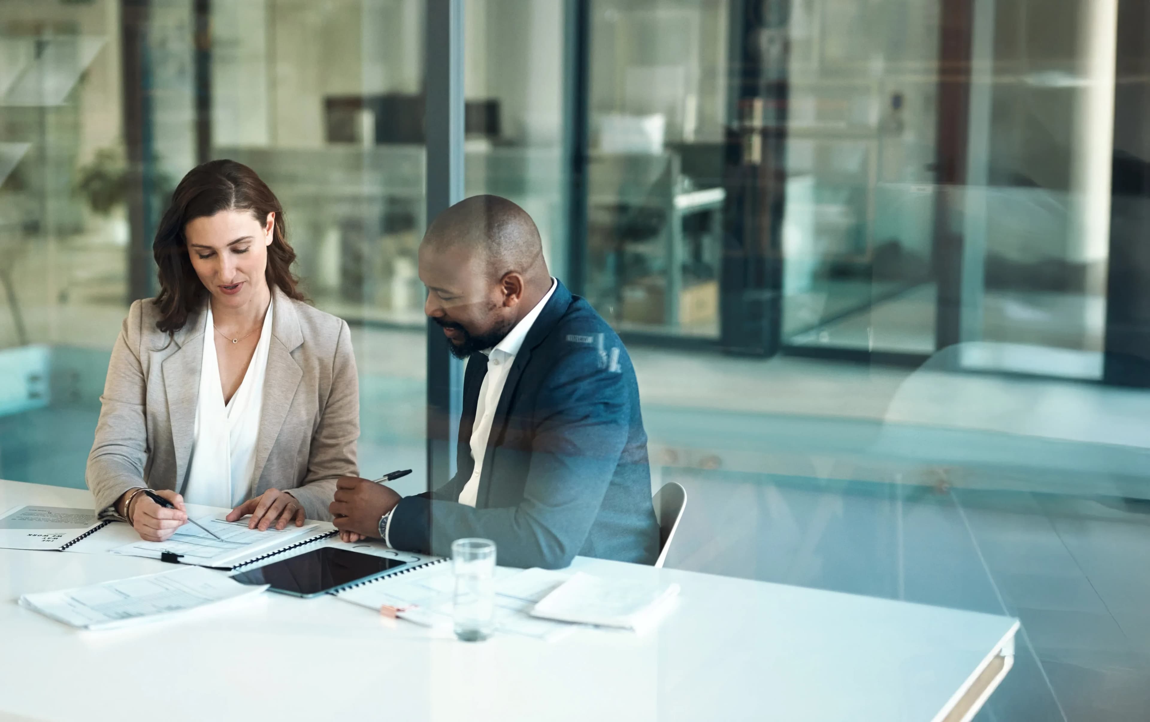 consultants-reviewing-documents-together