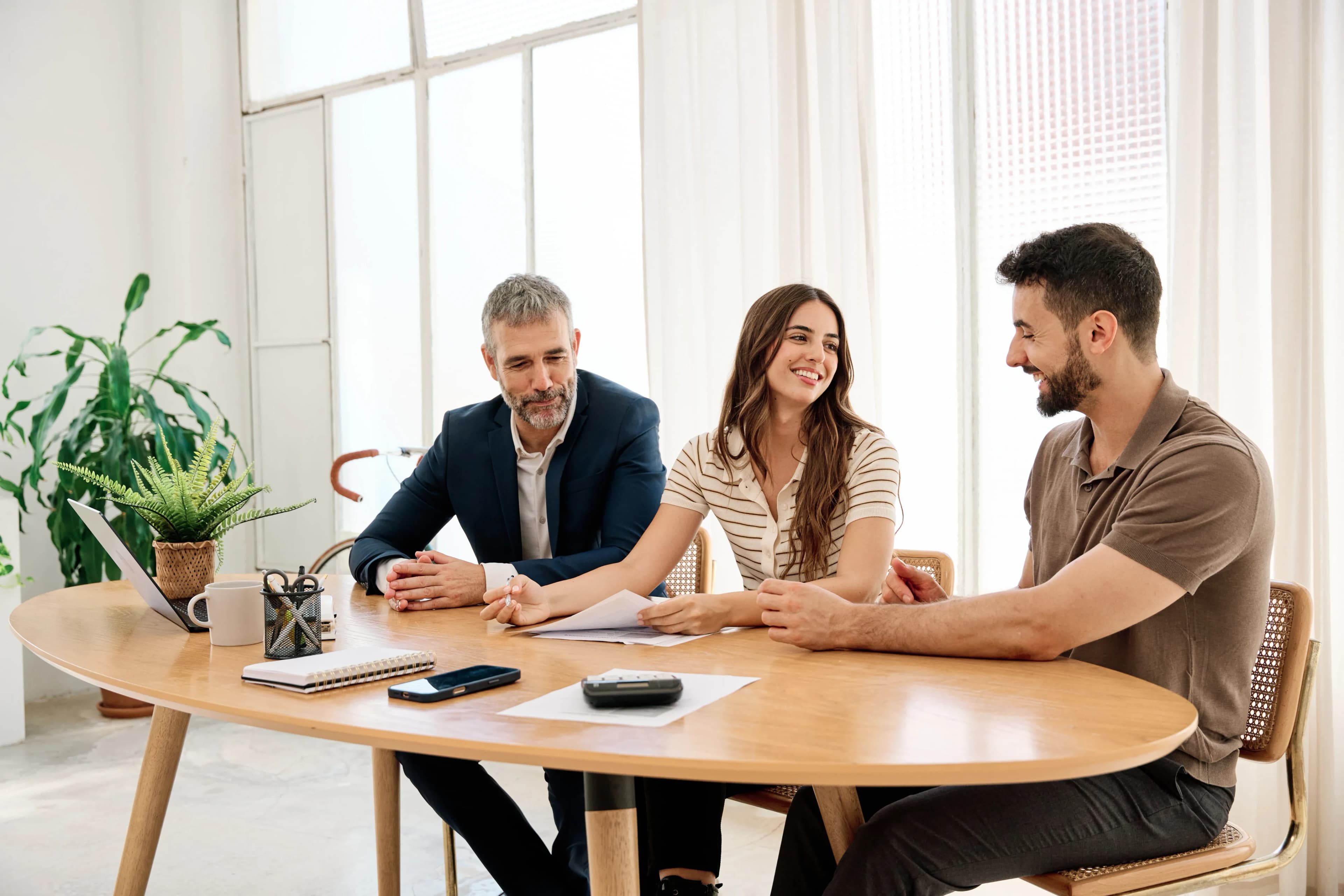 colleagues-smiling-around-table