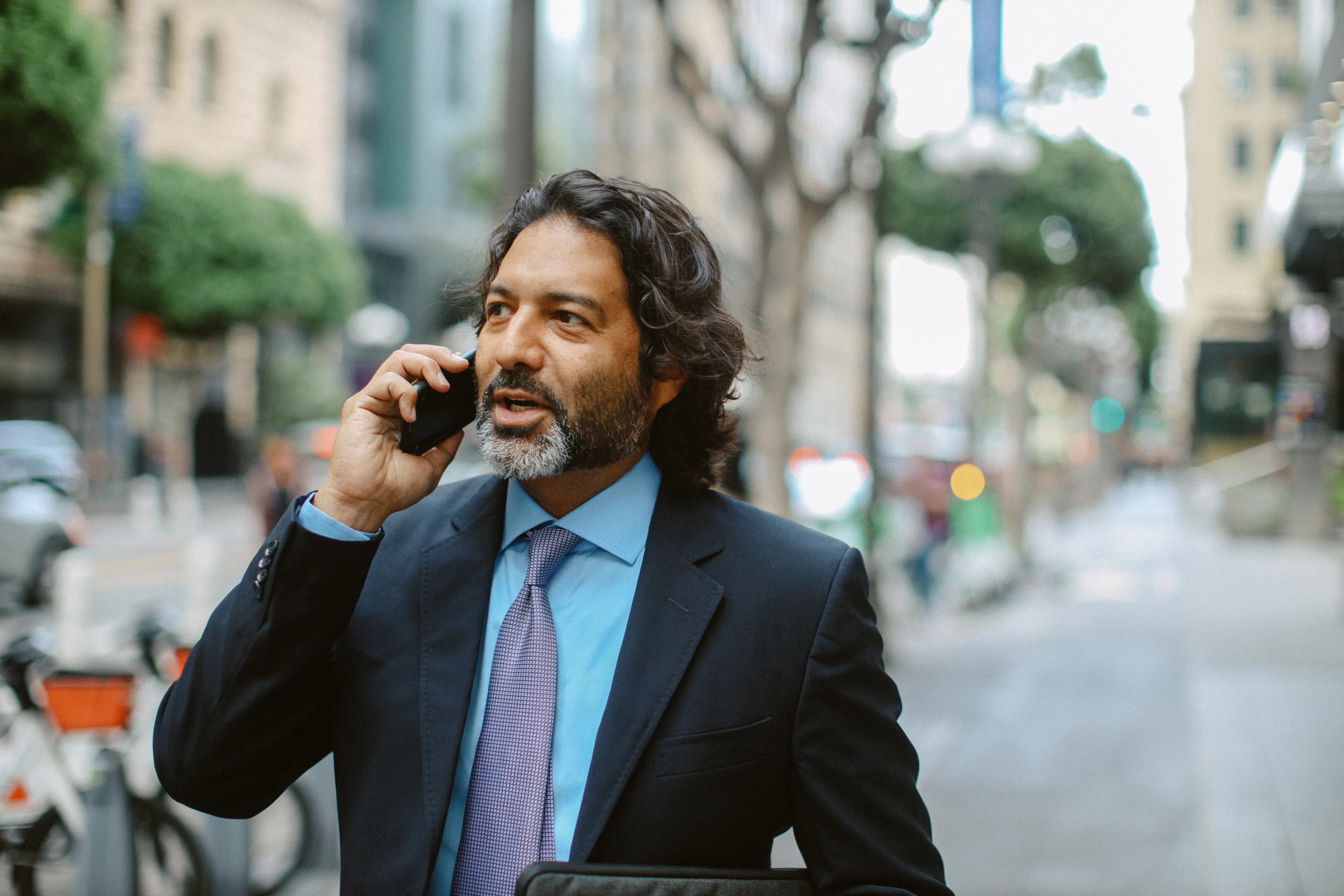 man-on-phone-city-street
