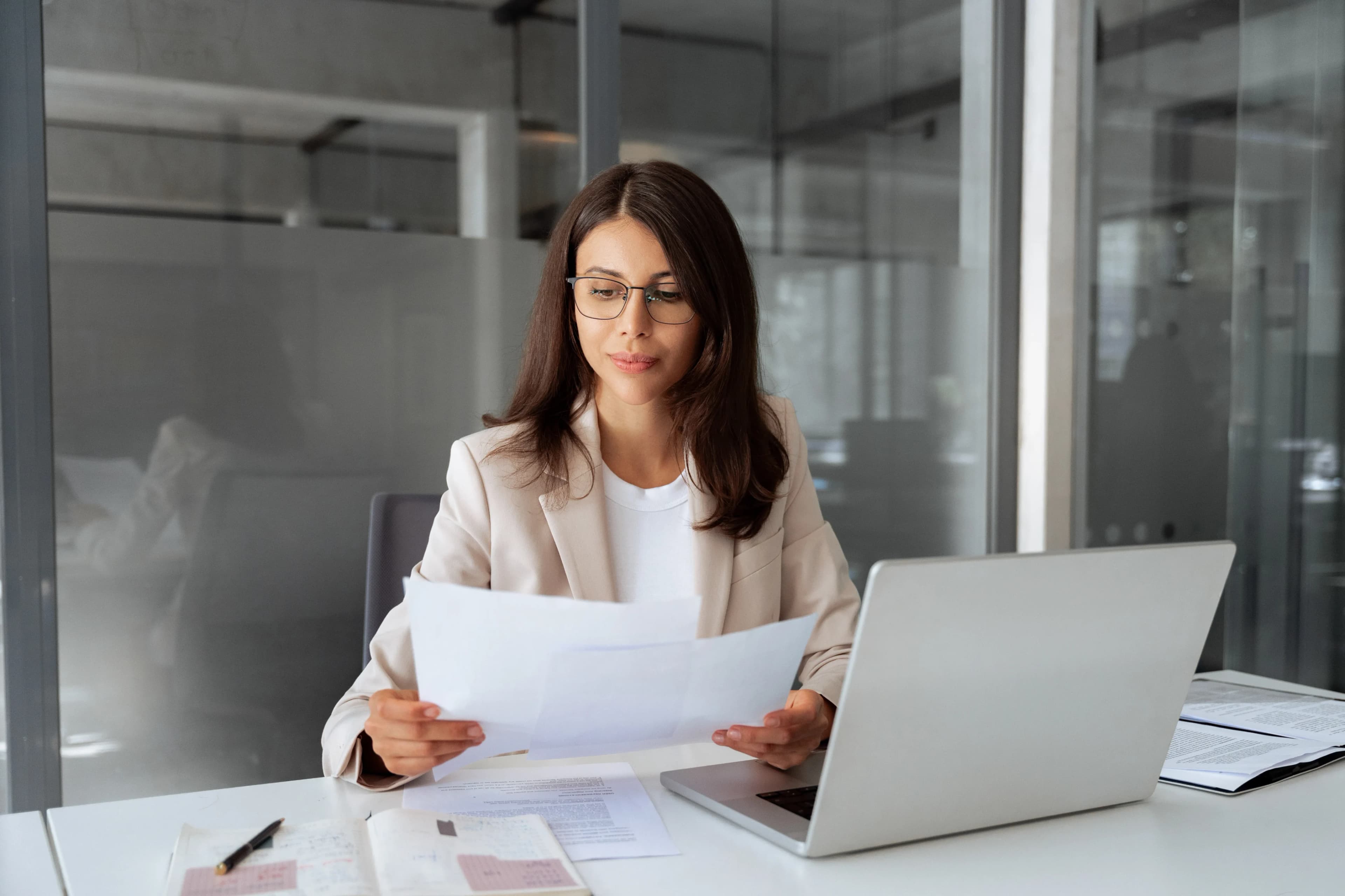professional-reviewing-documents-laptop