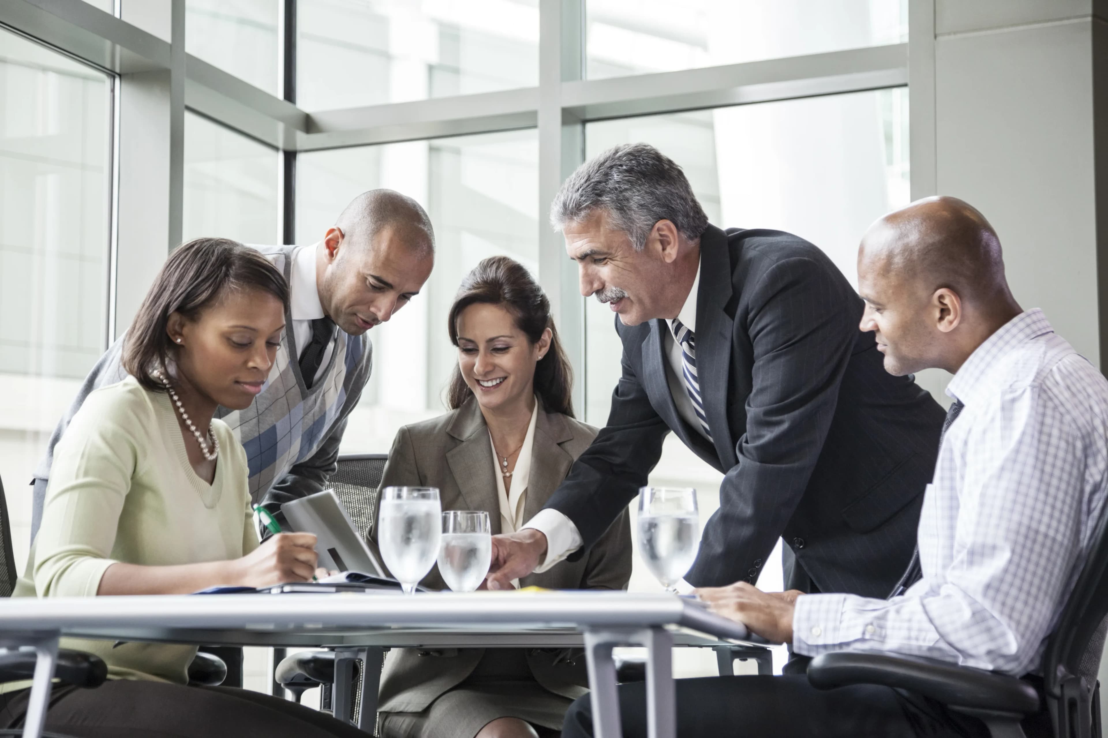 leaders-reviewing-documents-table